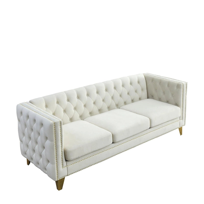 Divano moderno in velluto con bottoni e gambe in metallo